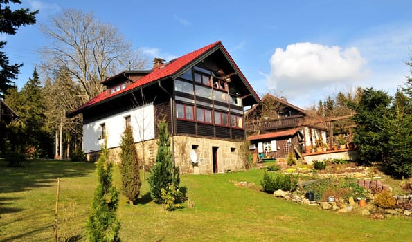 House with garden and meadow