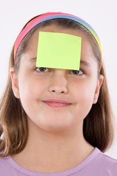 Adorable girl with post-it in her front