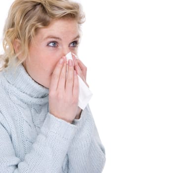 Woman blowing her nose