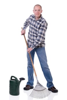 Man with watering can and rake