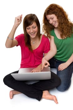 Two teenagers using laptop