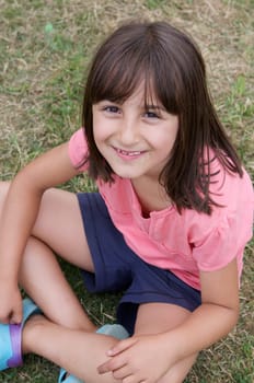 Beautiful little girl sitting