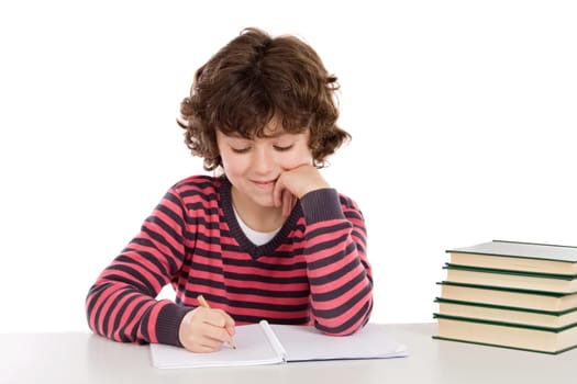 Adorable child writing in the school