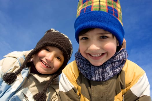 Cute girl and boy winter portrait