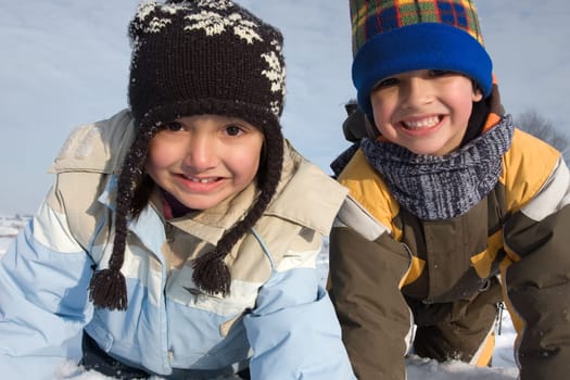 Cute girl and boy winter portrait