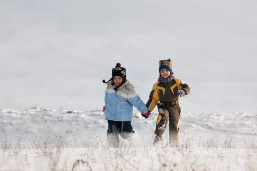 Little girl and boy running
