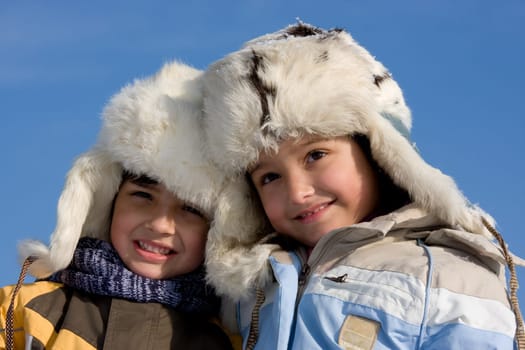 Children portrait in the fur-cup