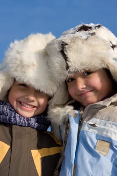 Children portrait in the fur-cup