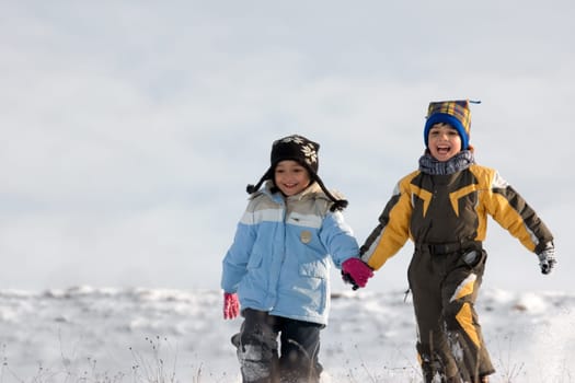 Little girl and boy running