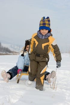 Running boy with sleihg