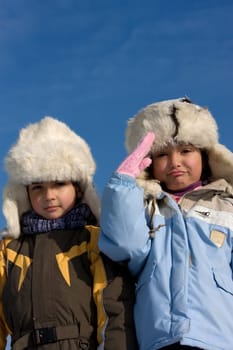 Children portrait in the fur-cup