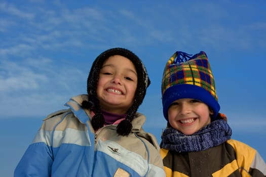 Cute girl and boy winter portrait