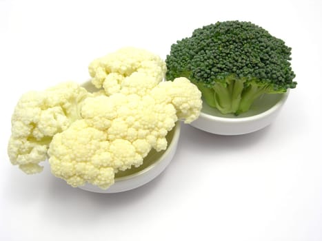 Cauliflower and broccoli in small bowls