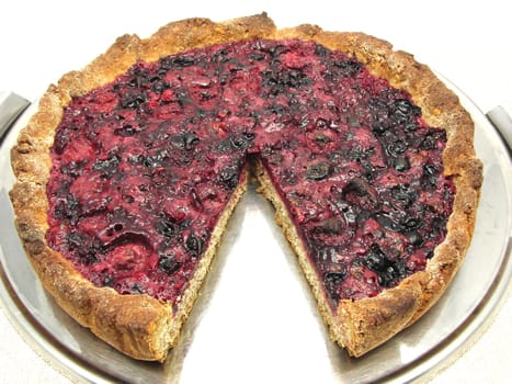 Sliced berry cake on cake tray