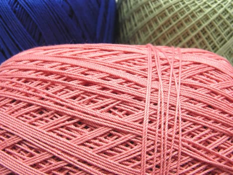Wool balls in blue,green and pink as a close-up