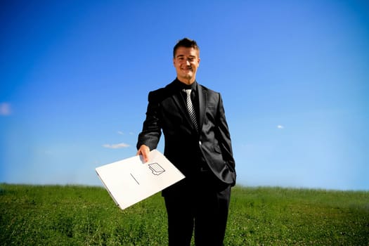 Young man handing a folder