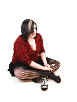 Girl sitting on floor.