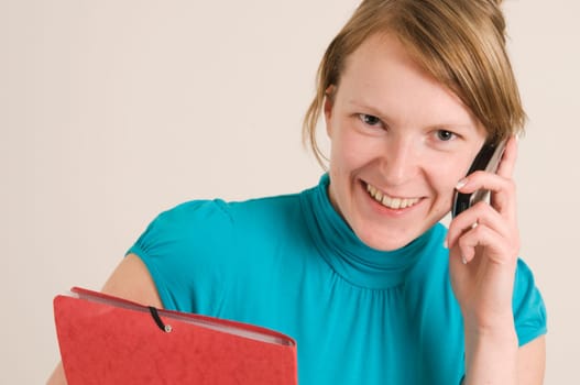 woman with phone and documents horizontal