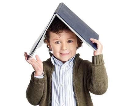 Happy boy with book on the head isolated
