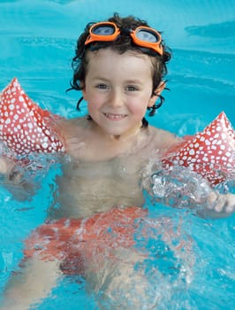 Little boy learning to swim
