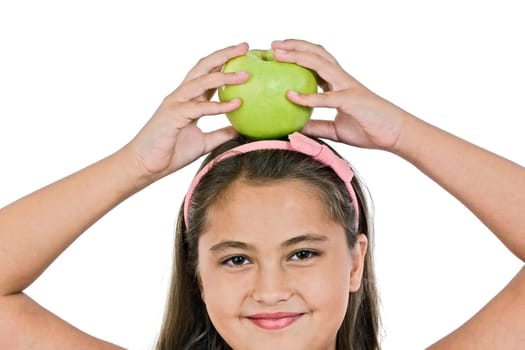 Adorable girl with a apple on her head