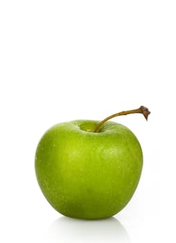 Wet green apple on a white background