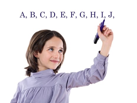 Adorable girl writing the ABC