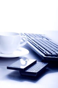 Keyboard, coffee cup and PDA  - high key