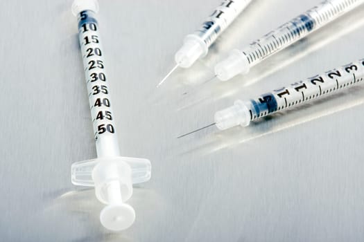 Four medical syringes