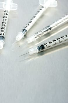 Four medical syringes
