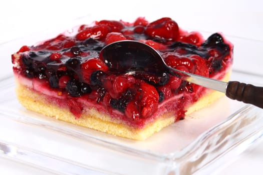 fruit cake in glass plate on white background
