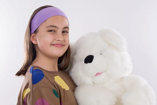 Little girl with her teddy bear