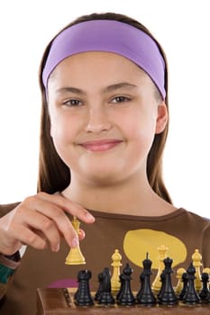 Attractive little girl playing chess