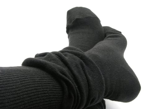 Feet in black,thick,long stockings