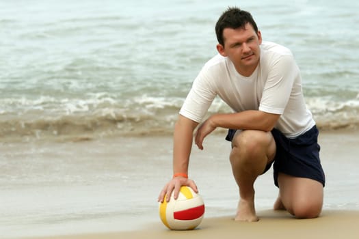 Man having volleyball on the beach