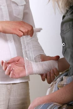 Apply bandage to forearm