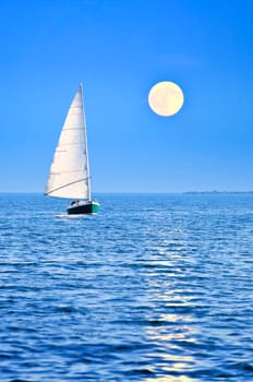 Sailboat at full moon