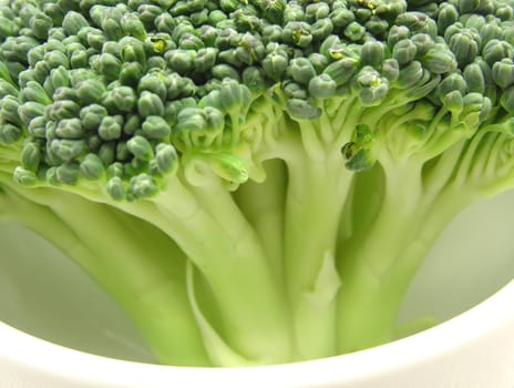 Broccoli in a small porcelain bowl