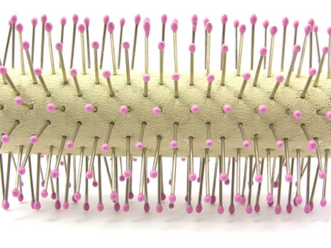Close-up of a round brush on a white background