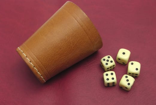Lying dice cup and dice