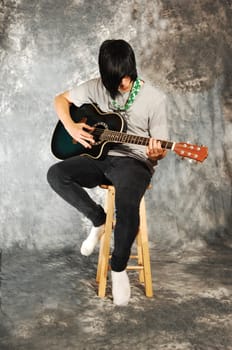 Boy with guitar.