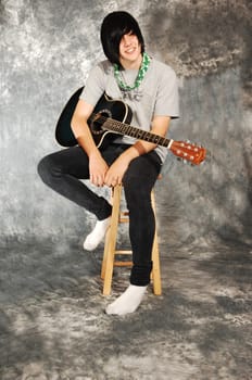 Boy with guitar.