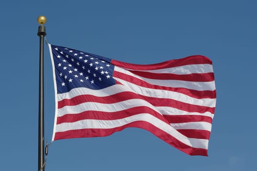 American flag against blue sky