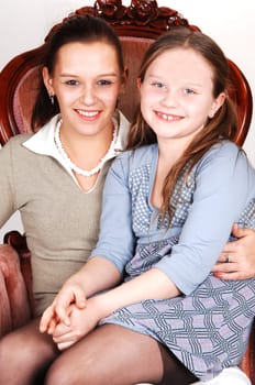 Mother and daughter in Armchair.
