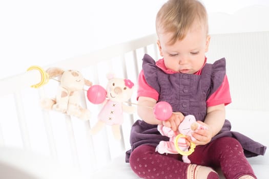 Baby Girl playing in bed