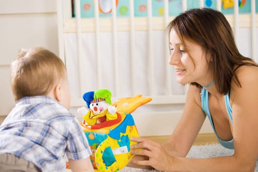 Baby and mother playing