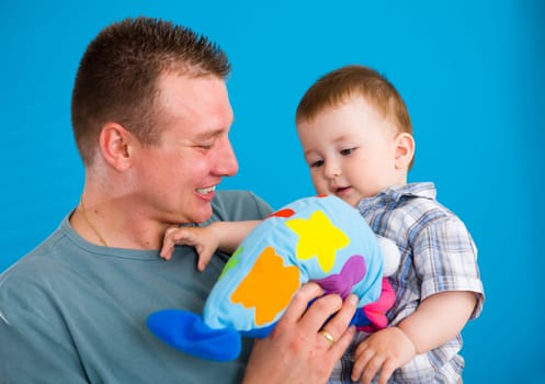 Father carrying happy baby
