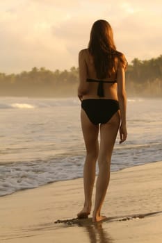 Woman walking on the beach
