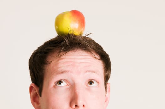 look to the apple on head