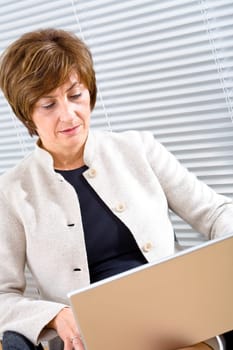 Businesswoman working on laptop